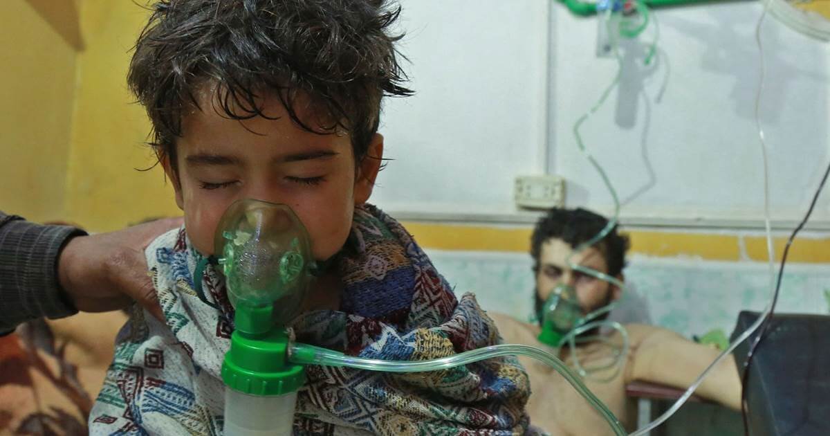 Chlorine gas symptoms reported after 'enormous explosion' in Syria