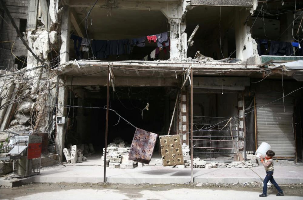 'Unsafe even to bury the dead' in besieged Syrian enclave