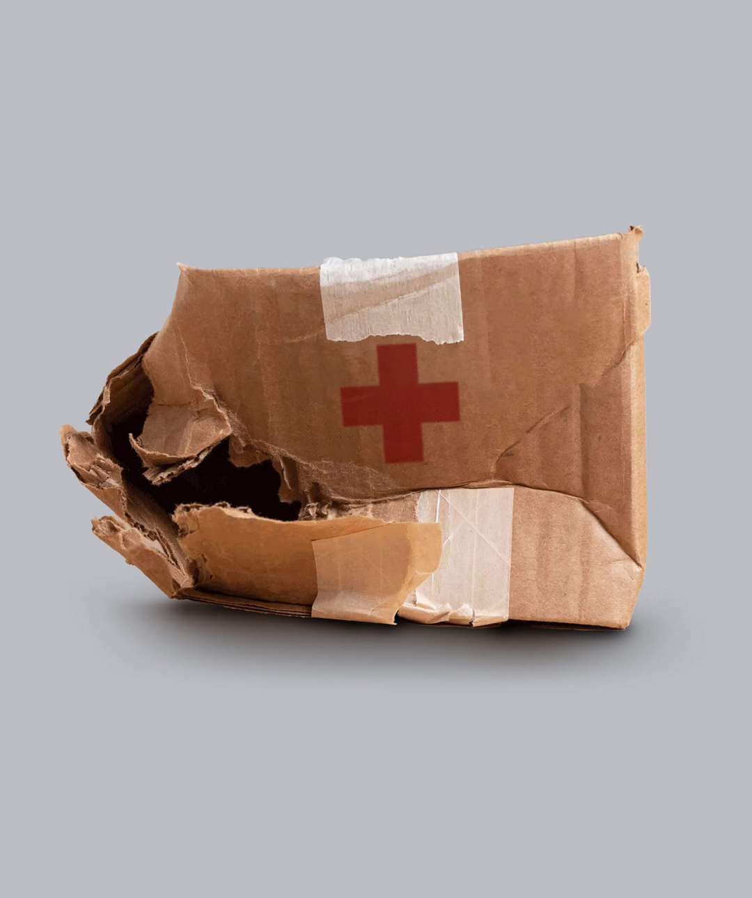 Crumpled up box with Red Cross