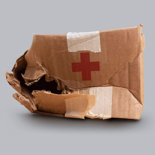 Crumpled up box with Red Cross