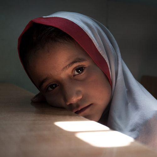 Young Afghan girl inside a classroom