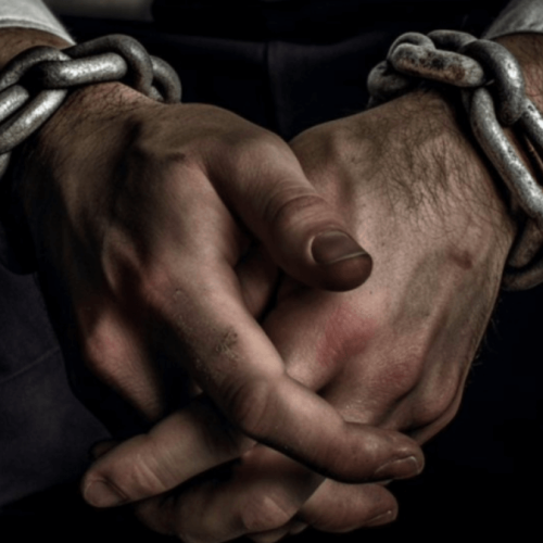 Taken blog post header showing chained up hands