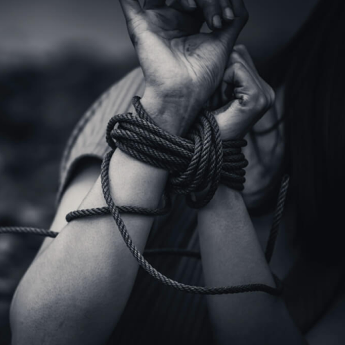 Hands tied together by a rope with a ominent black and white shade