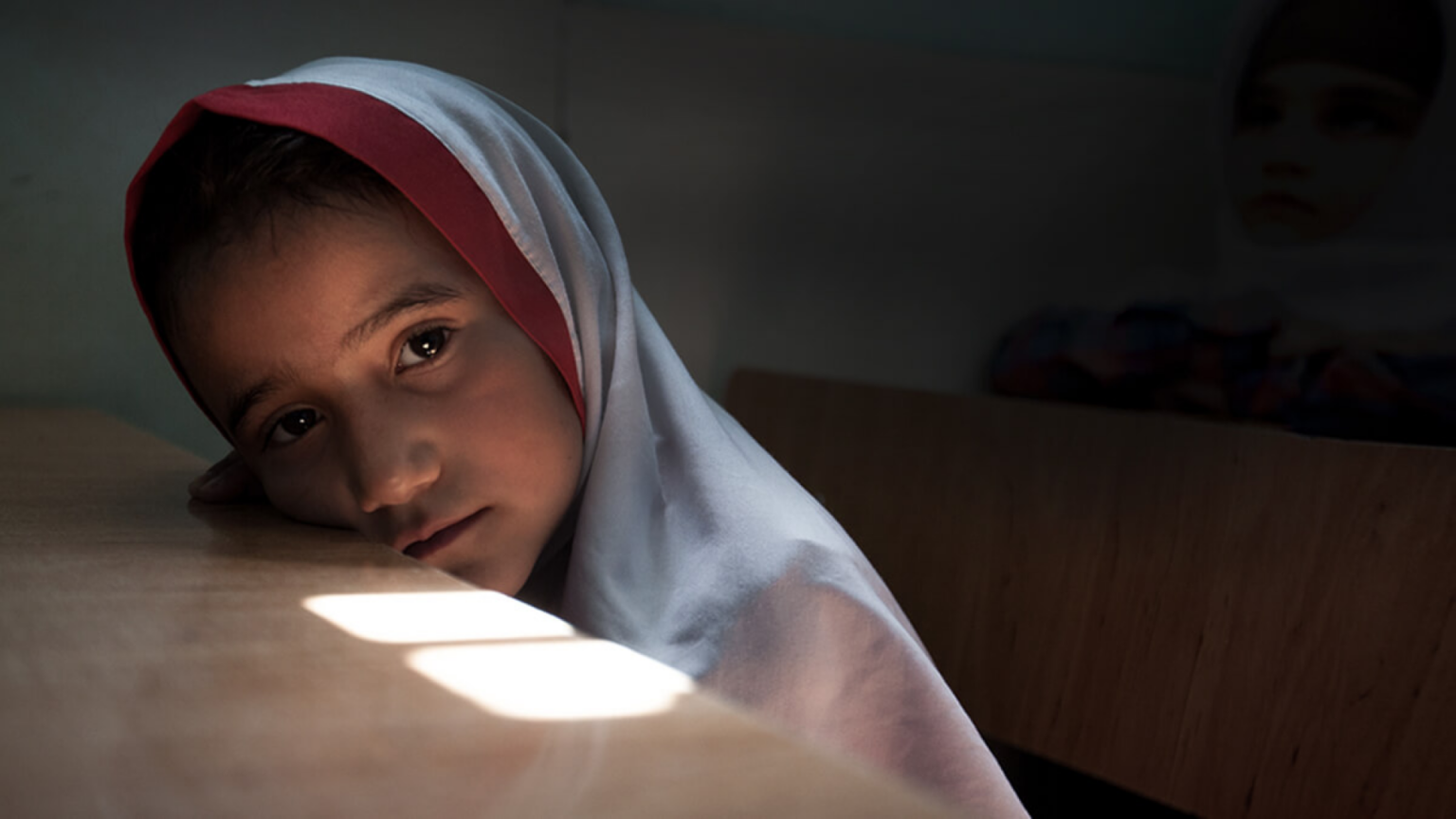 Young Afghan girl inside a classroom