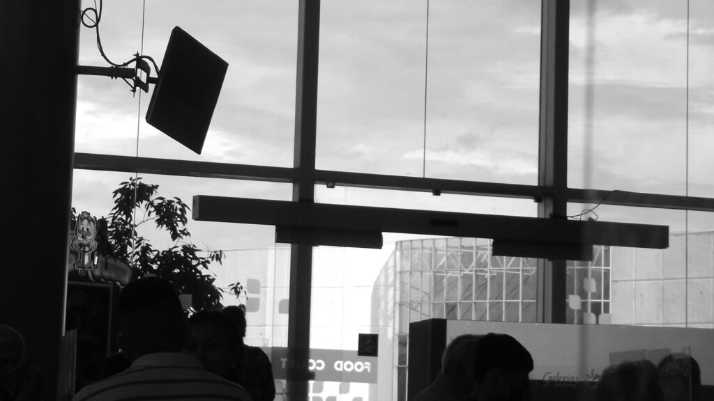 Black and White image of standard room with screens