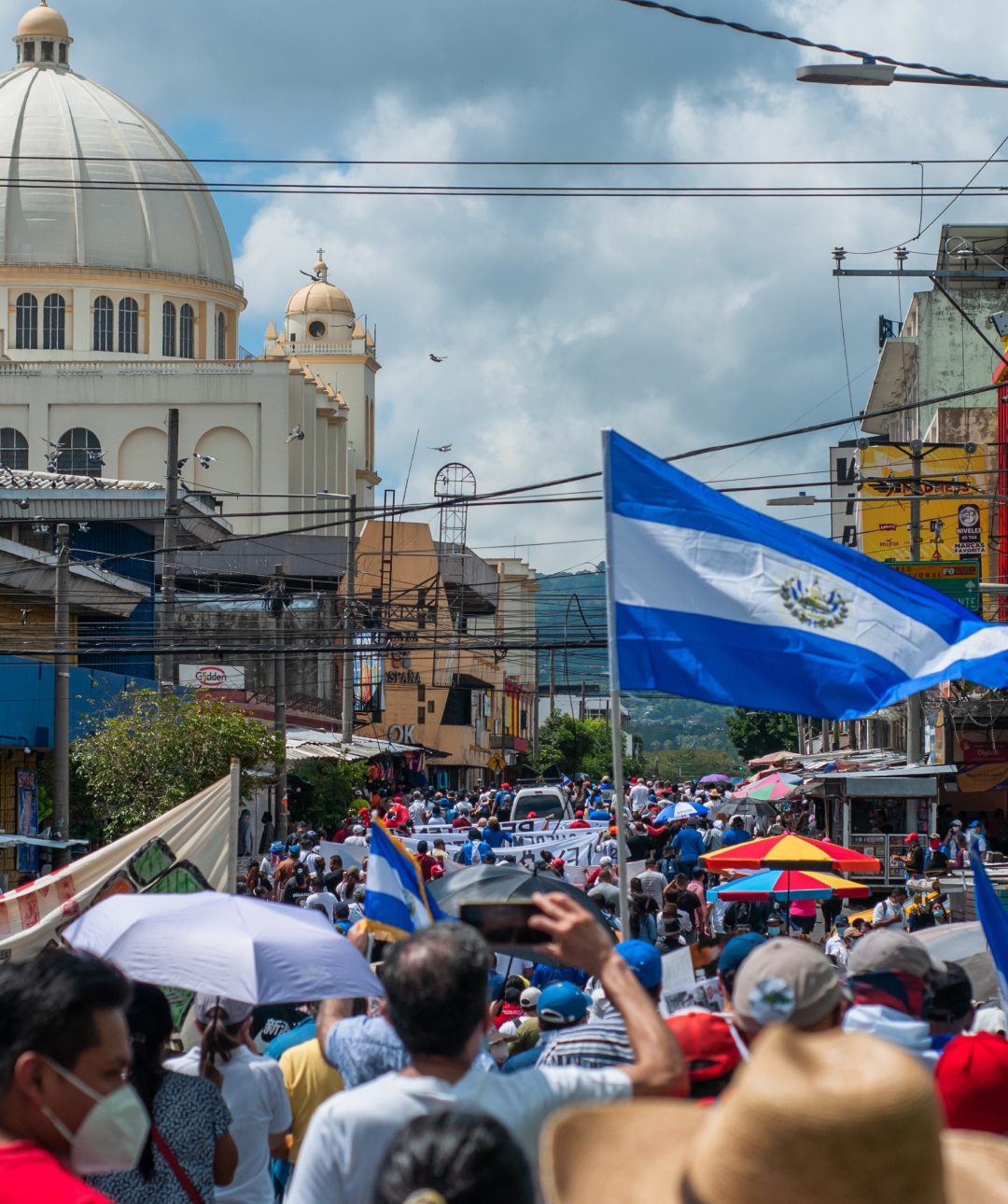 El Salvador flag waving in crowd of people in the nations capital