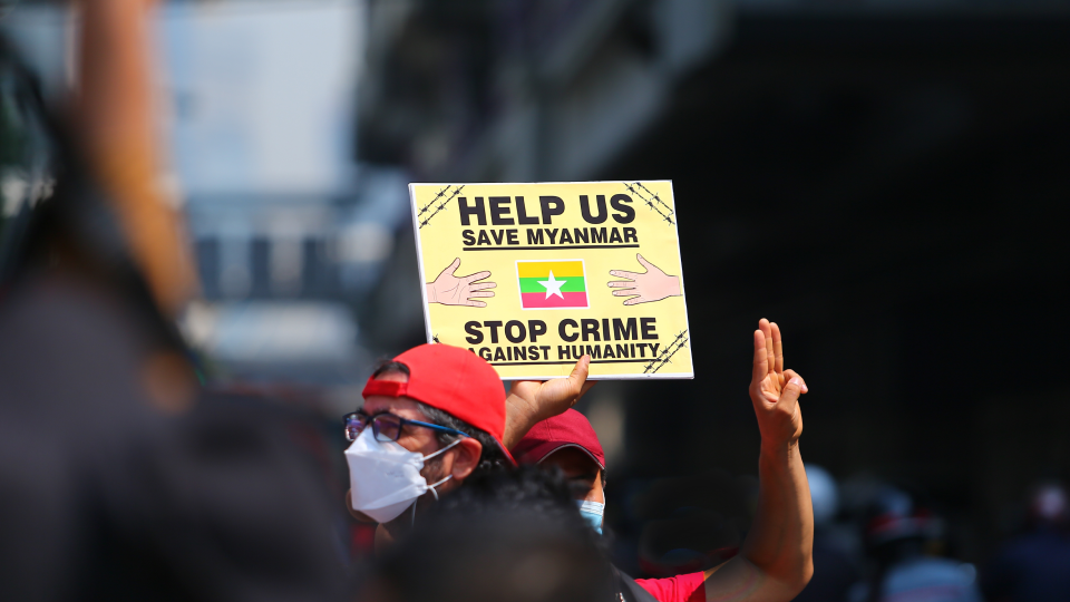 Youthquake Report - A Burmese protester holds up a three-finger salute