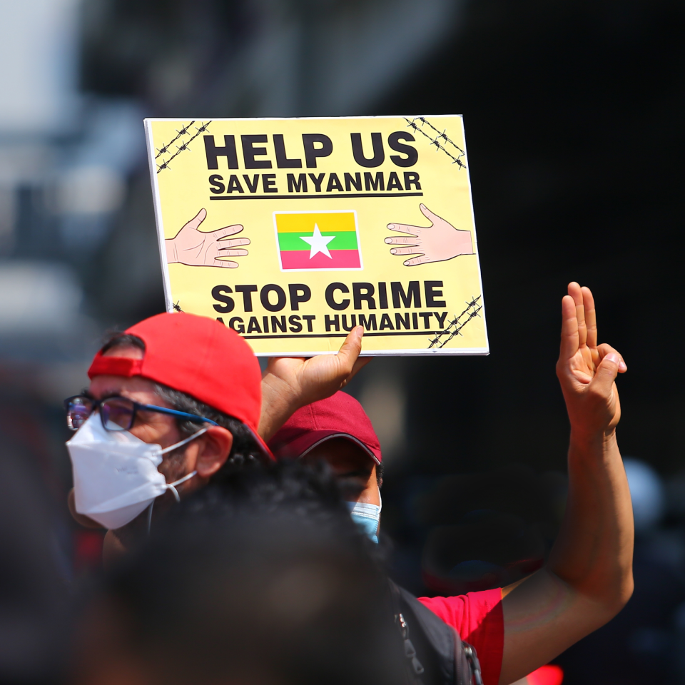 Youthquake Report - A Burmese protester holds up a three-finger salute