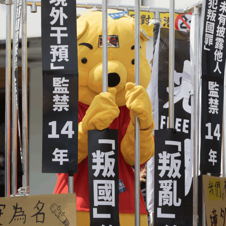 Youthquake Report - A protester in Taiwan dresses up as Winnie the Pooh behind a fake jail cell, to express solidarity with Hong Kongers protesting the passage of another national security law, Article 23