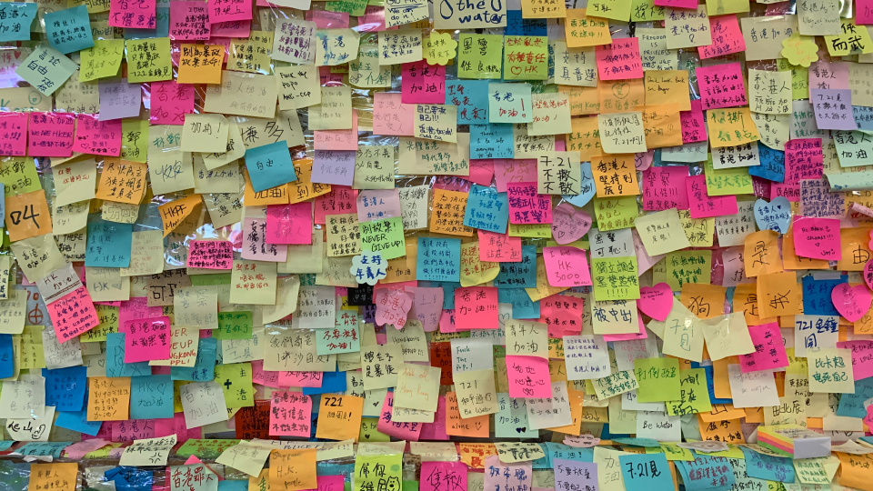 Youthquake Report - Hong Kongers write anonymous messages of encouragement on post-it notes to stick on a wall of Tsuen Wan