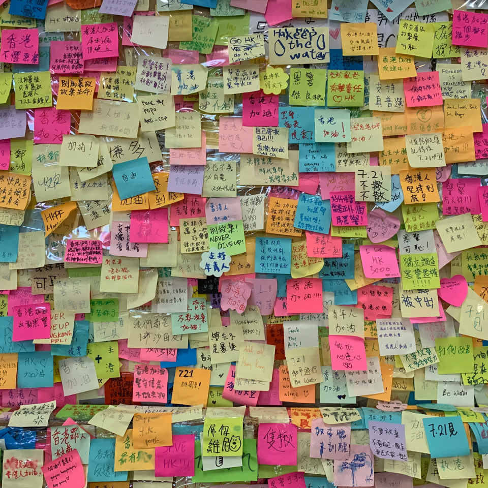 Youthquake Report - Hong Kongers write anonymous messages of encouragement on post-it notes to stick on a wall of Tsuen Wan